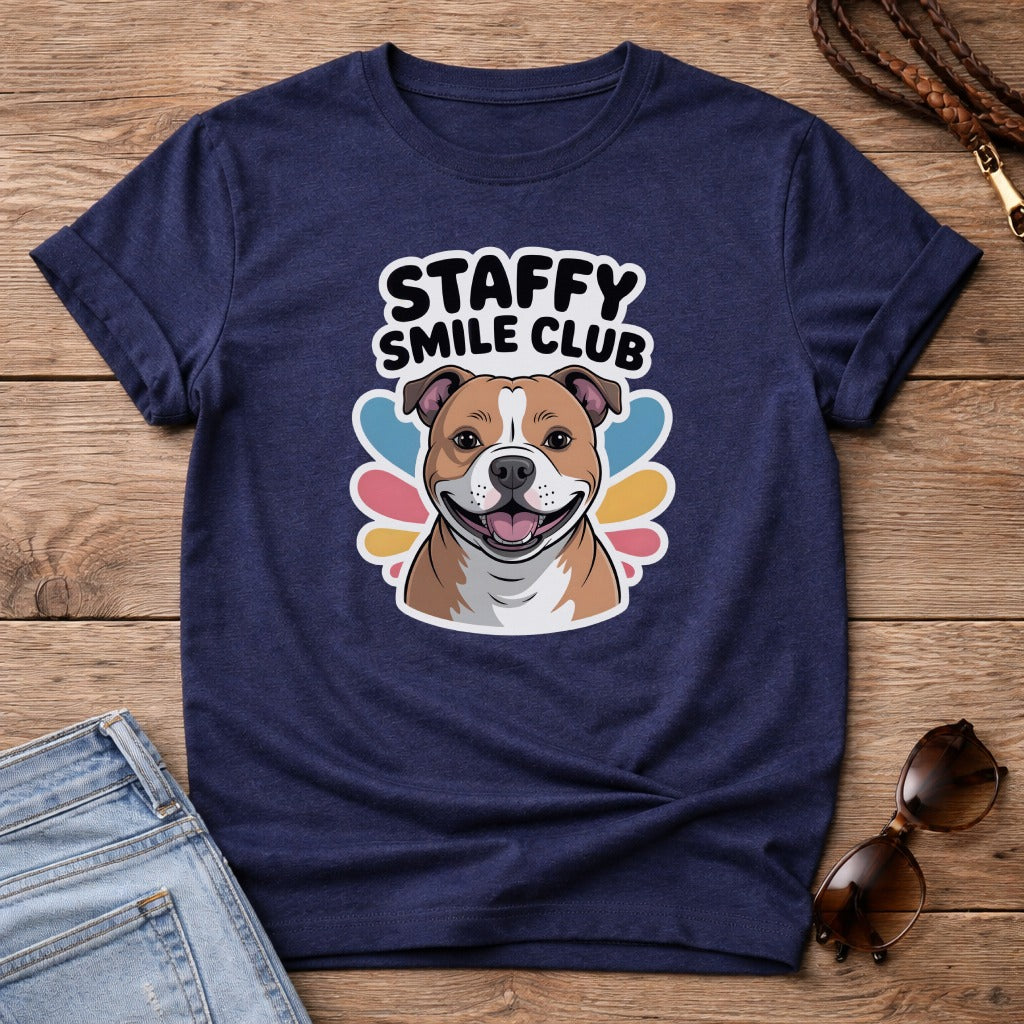 Navy t-shirt with smiling Staffordshire Bull Terrier and "Staffy Smile Club" text.