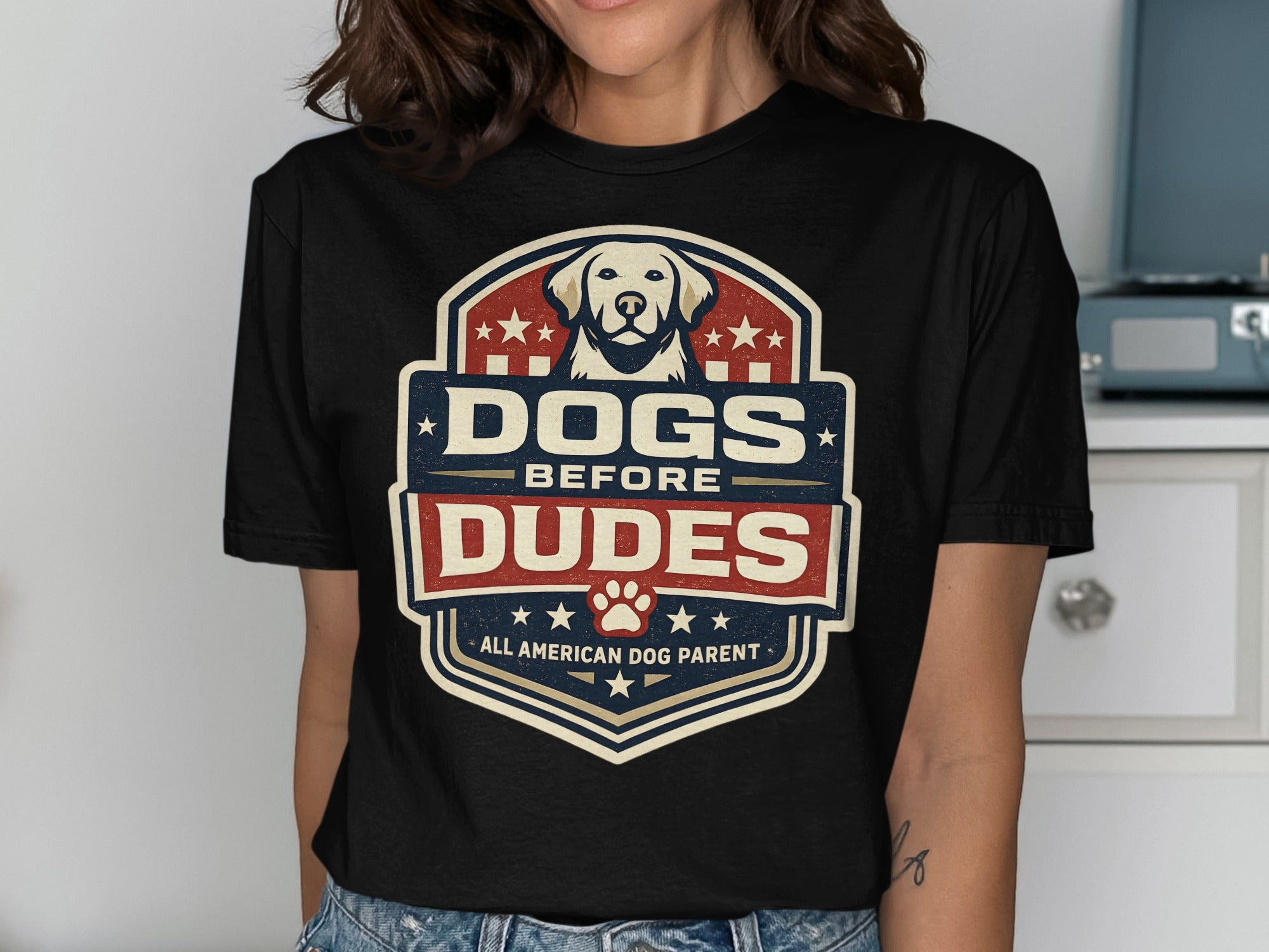 Black t-shirt with "Dogs Before Dudes" shield logo and dog graphic.