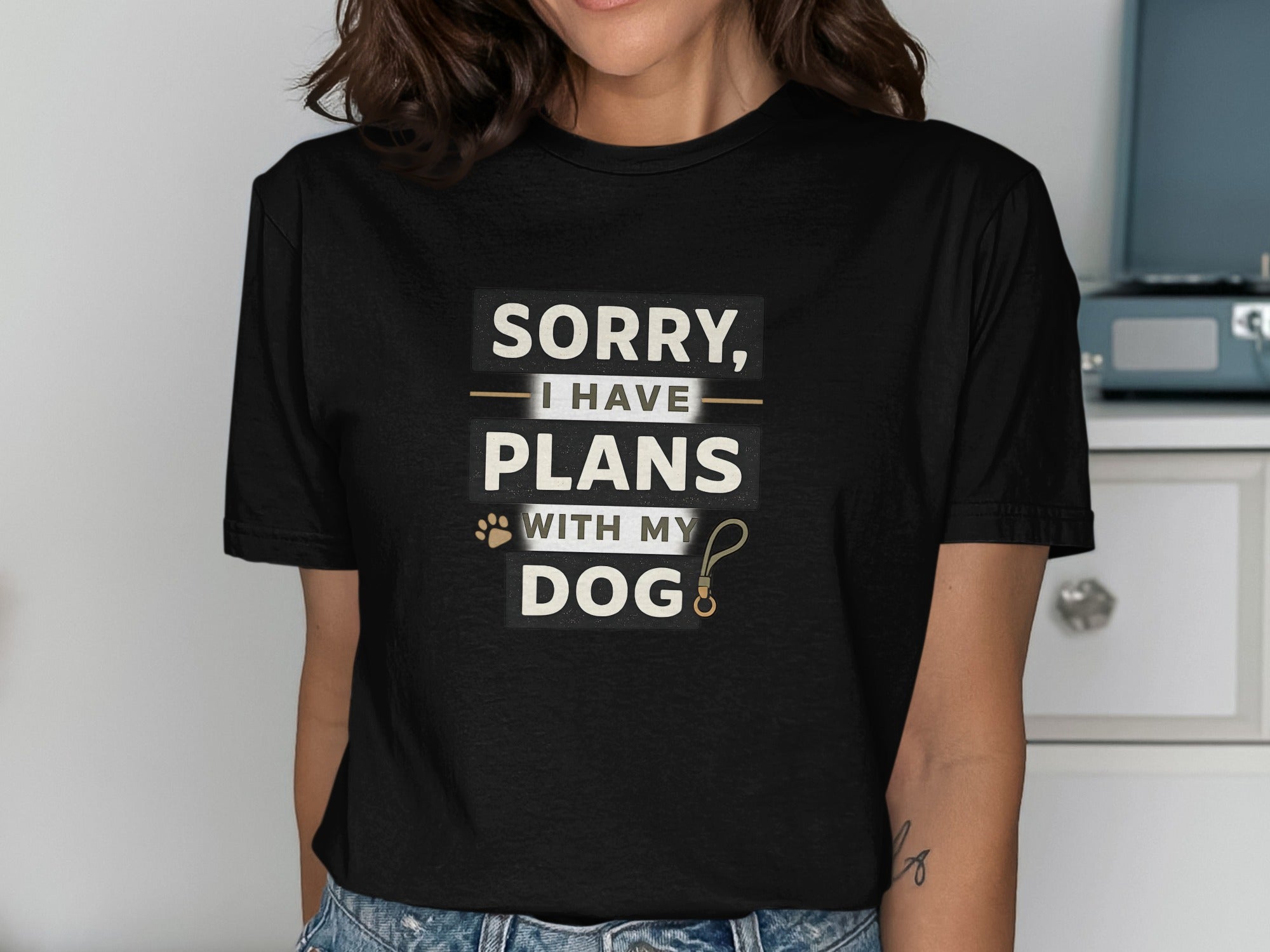 Black t-shirt with "SORRY, I HAVE PLANS WITH MY DOG" text and a paw print.