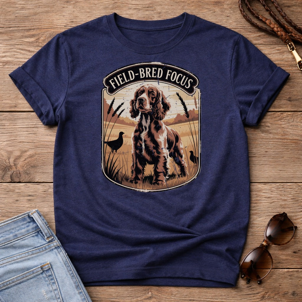 Navy t-shirt with a graphic of a field-bred English Springer Spaniel in a field.