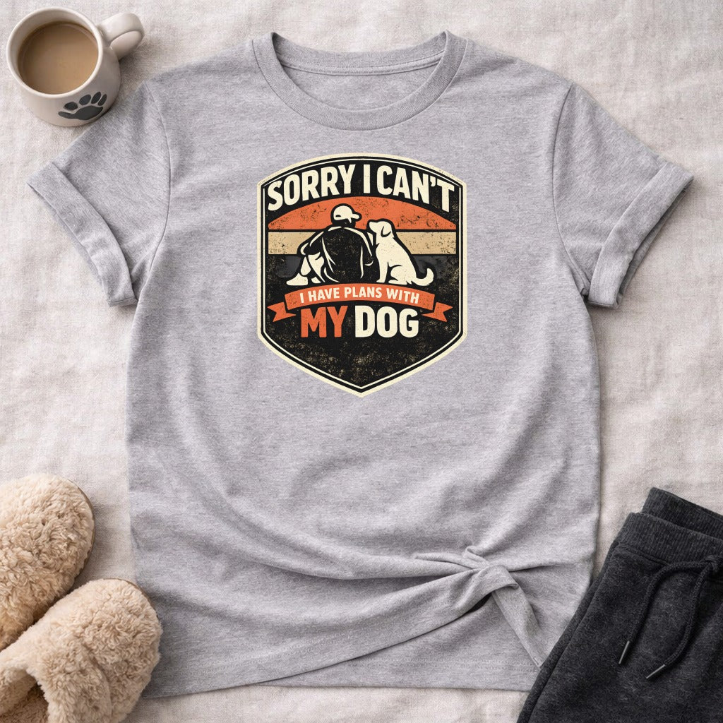 T-shirt with "Sorry I Can't I Have Plans With My Dog" slogan and dog and person graphic.