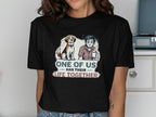 T-shirt graphic: dog and tired man with text "One of us has their life together".