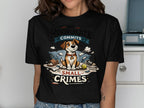 T-shirt graphic of a dog sitting on pillows with "MY ROOMMATE COMMITS SMALL CRIMES" text.
