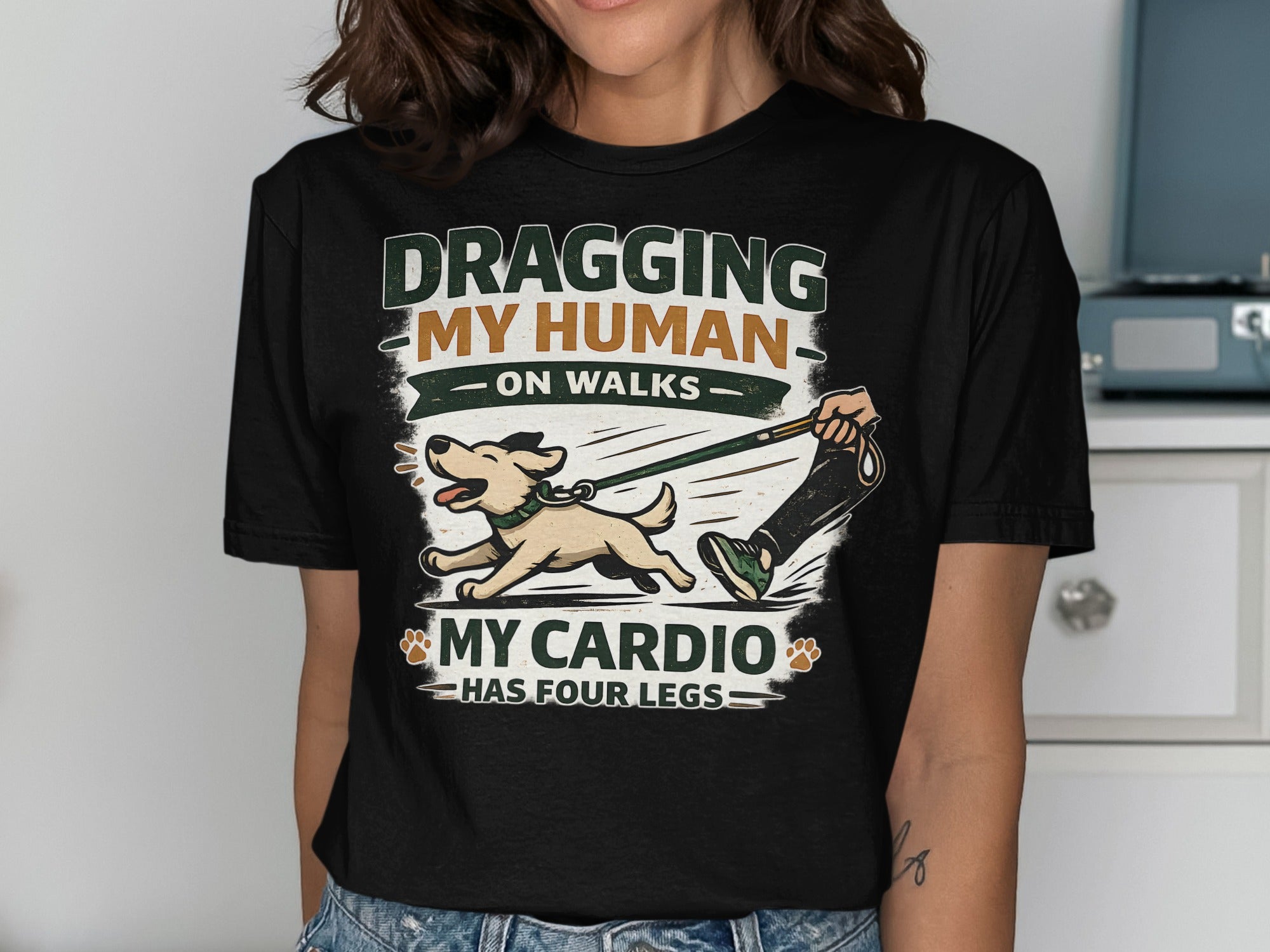 T-shirt with "Dragging My Human On Walks My Cardio Has Four Legs" graphic.