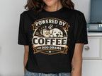 Black t-shirt with text "Powered by Coffee and Dog Drama" and a sleeping dog.