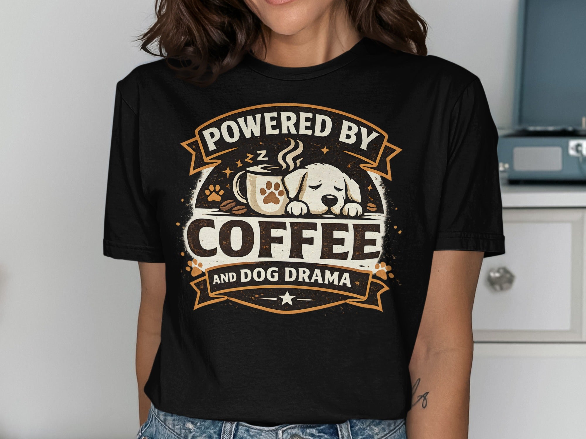 Black t-shirt with text "Powered by Coffee and Dog Drama" and a sleeping dog.