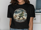 T-shirt with graphic of person and dog walking in storm with text "I walk in storms for someone who eats grass".