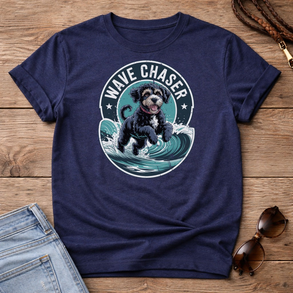 Black dog jumping through waves on a navy blue t-shirt.