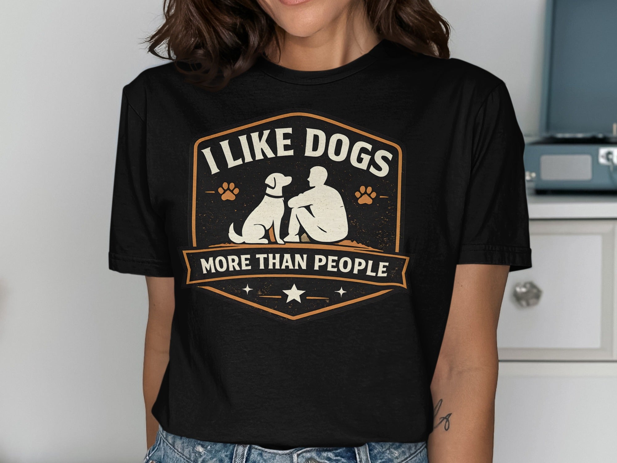Black t-shirt with "I Like Dogs More Than People" text and dog silhouette graphic.