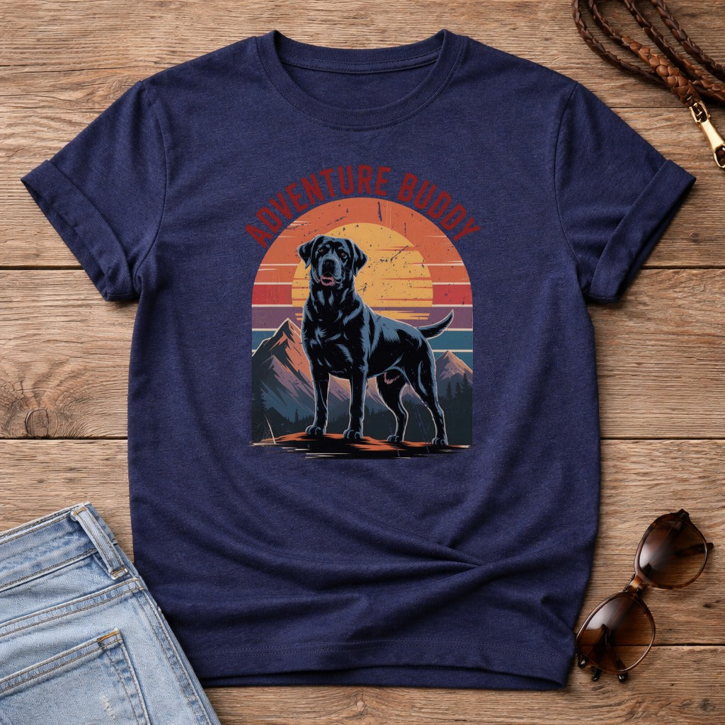 Black Labrador dog standing on mountain with vintage sunset graphic on t-shirt.