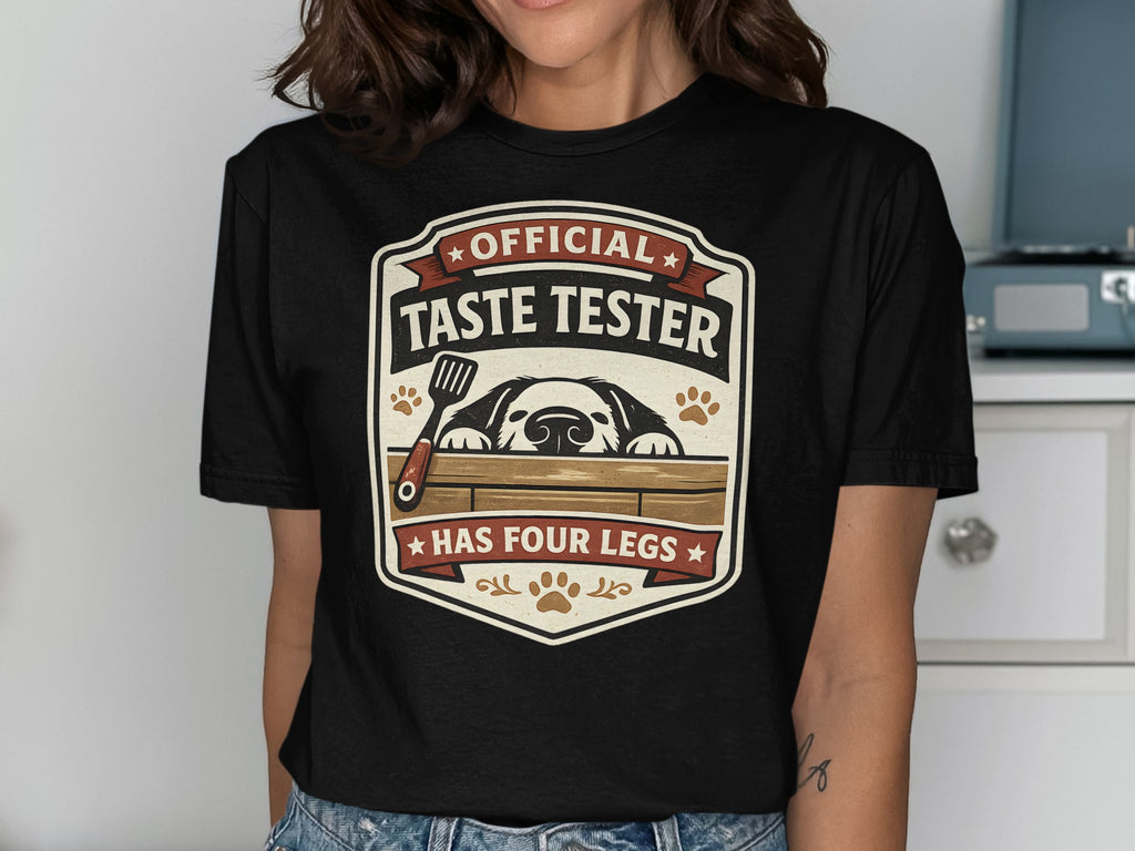 Black t-shirt with "Official Taste Tester Has Four Legs" dog graphic.