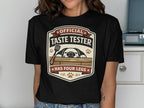 Black t-shirt with "Official Taste Tester Has Four Legs" dog graphic.