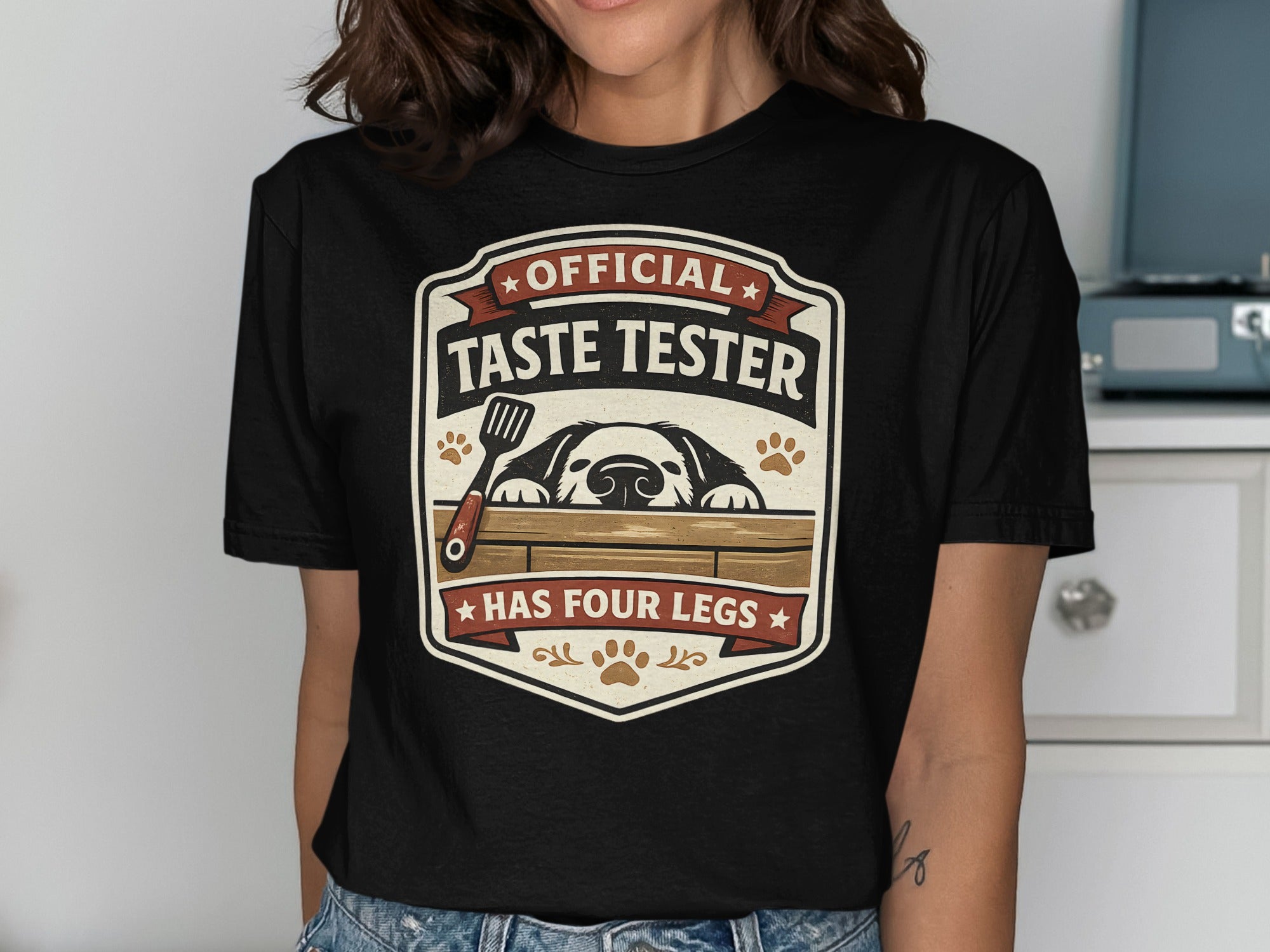 Black t-shirt with "Official Taste Tester Has Four Legs" dog graphic.