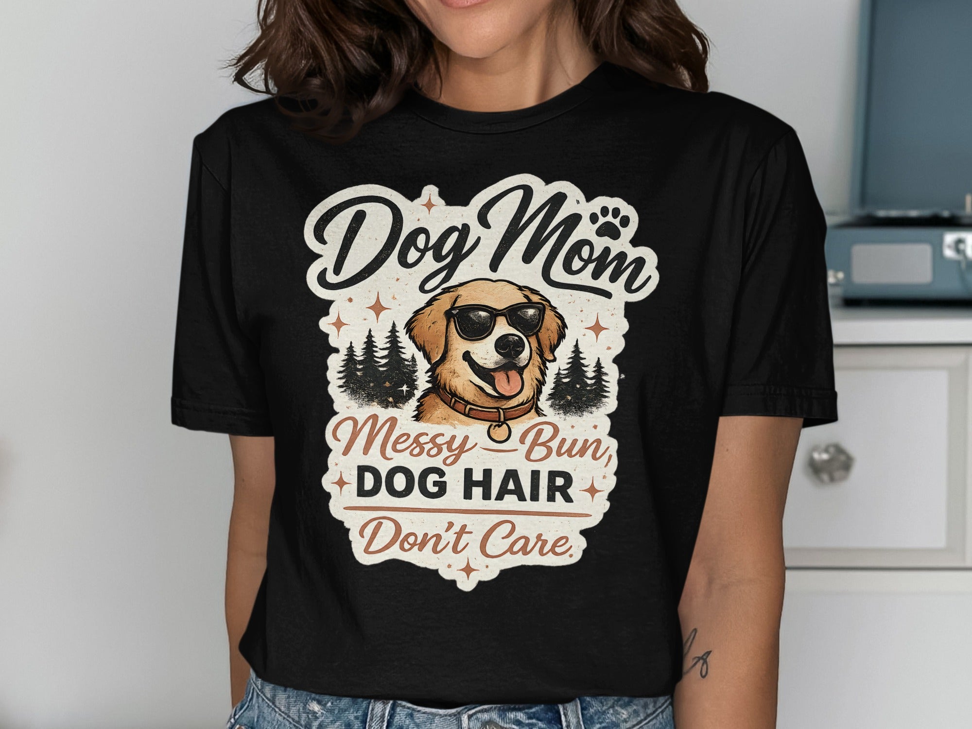 Dog Mom messy hair don't care graphic on a black t-shirt.
