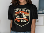 Shirt with "Sorry I Can't I Have Plans With My Dog" text and dog graphic.