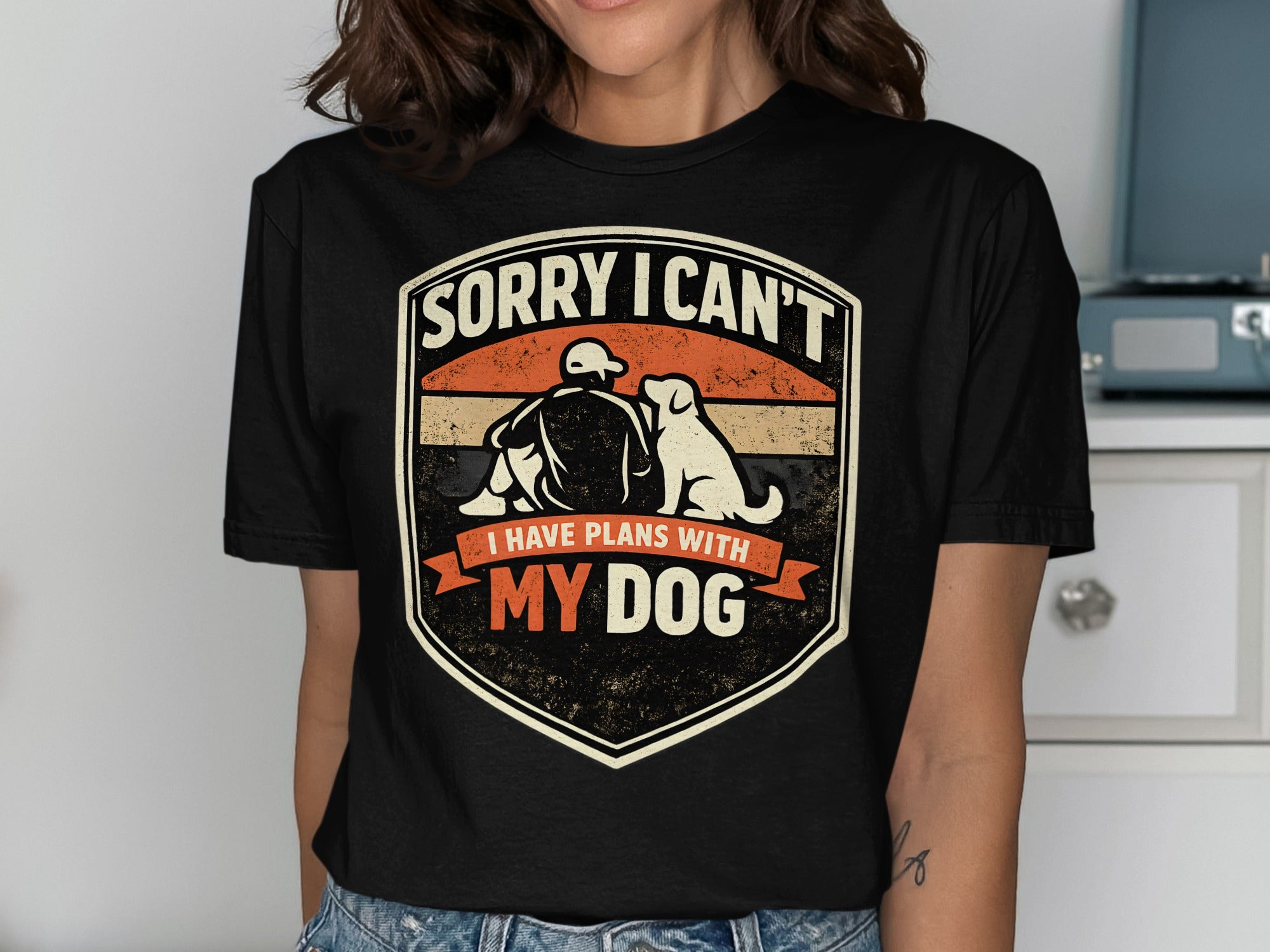 Shirt with "Sorry I Can't I Have Plans With My Dog" text and dog graphic.